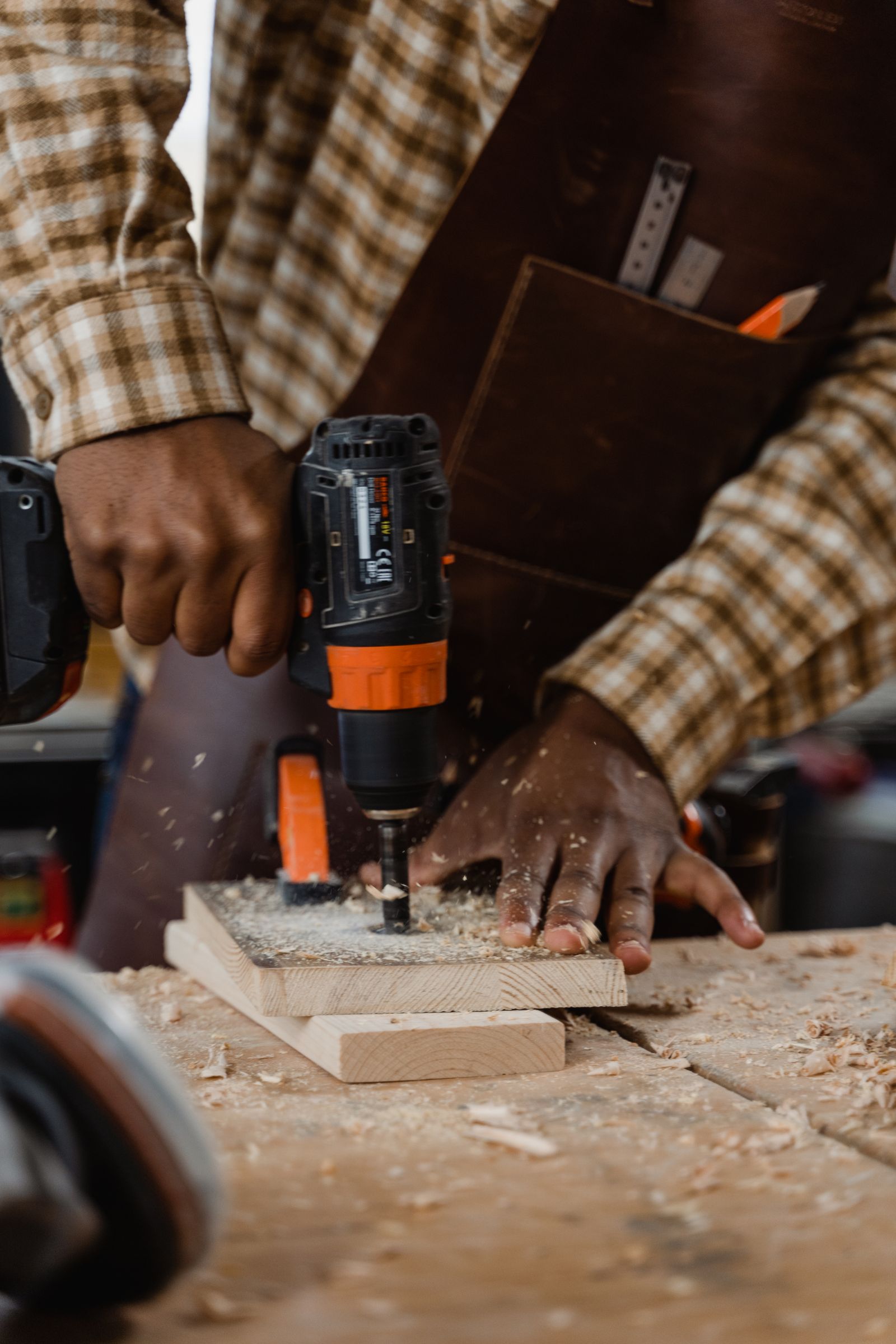 Carpenter drilling a timber piece