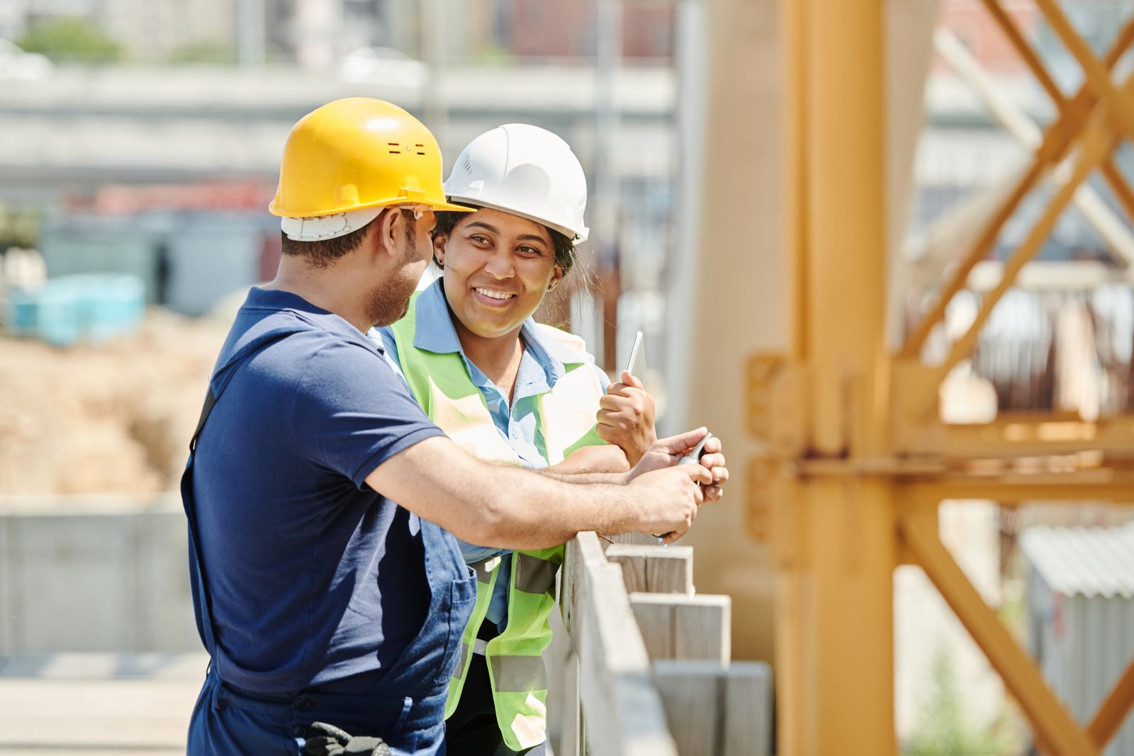 Site engineers discussing plans on a construction site